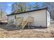 Backyard view of the home featuring new stairs and fresh exterior paint at 2529 Dale Creek Nw Dr, Atlanta, GA 30318