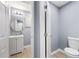 Small bathroom with a vanity, a toilet, a mirror, and hardwood floors at 2529 Dale Creek Nw Dr, Atlanta, GA 30318