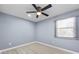 The empty bedroom has hardwood floors, a ceiling fan, a window with blinds, and recessed lighting at 2529 Dale Creek Nw Dr, Atlanta, GA 30318