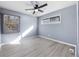 Empty bedroom with hardwood floors, a ceiling fan, recessed lighting, and a large window at 2529 Dale Creek Nw Dr, Atlanta, GA 30318