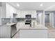 Modern kitchen with white cabinets, granite countertops, and island at 2529 Dale Creek Nw Dr, Atlanta, GA 30318