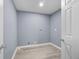 Basement laundry room with gray walls and wood-look flooring at 2529 Dale Creek Nw Dr, Atlanta, GA 30318