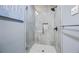 The large, glass-enclosed shower has gray tiling, white floors, and a rainfall shower head at 2529 Dale Creek Nw Dr, Atlanta, GA 30318