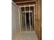 Unfinished basement hallway with framed walls at 6615 Bluffview Dr, Douglasville, GA 30134