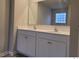 Double vanity bathroom with a large mirror and updated fixtures at 6615 Bluffview Dr, Douglasville, GA 30134