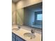 Double vanity bathroom with a large mirror and soaking tub at 6615 Bluffview Dr, Douglasville, GA 30134