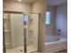 Bathroom with shower and bathtub, offering both options for bathing at 6615 Bluffview Dr, Douglasville, GA 30134