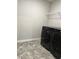 Laundry room with washer, dryer, and shelving at 6615 Bluffview Dr, Douglasville, GA 30134