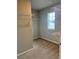 Walk-in closet with wire shelving and neutral carpet at 6615 Bluffview Dr, Douglasville, GA 30134