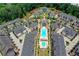 Community aerial view showing resort-style pool and numerous townhouses at 6770 Cadence Blvd, Atlanta, GA 30328