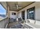 Outdoor balcony with seating area, ceiling fan, and TV at 6770 Cadence Blvd, Atlanta, GA 30328