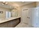 Double vanity bathroom with a large mirror and a glass shower at 6770 Cadence Blvd, Atlanta, GA 30328