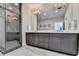 Double vanity bathroom with a large mirror and a glass shower at 6770 Cadence Blvd, Atlanta, GA 30328