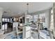 Open concept dining area with kitchen view and hardwood floors at 6770 Cadence Blvd, Atlanta, GA 30328