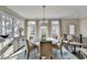 Bright dining room with round table and ample natural light at 6770 Cadence Blvd, Atlanta, GA 30328