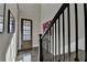 Bright entryway with dark hardwood floors and a charming front door at 6770 Cadence Blvd, Atlanta, GA 30328