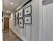 Stylish hallway with unique wall art and hardwood floors at 6770 Cadence Blvd, Atlanta, GA 30328