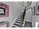 Modern staircase with dark wood treads and black spindles at 6770 Cadence Blvd, Atlanta, GA 30328