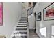 Modern staircase with dark wood treads and black spindles at 6770 Cadence Blvd, Atlanta, GA 30328