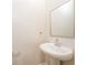 Small bathroom with pedestal sink and mirror at 1247 Sunny Lake Dr, Lawrenceville, GA 30043