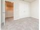 Bright bedroom featuring plush carpeting and double doors leading to a loft at 1247 Sunny Lake Dr, Lawrenceville, GA 30043