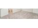 Bedroom with grey carpeting and an adjacent bathroom at 1247 Sunny Lake Dr, Lawrenceville, GA 30043