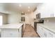 Modern kitchen with white cabinets, granite counters, and stainless steel appliances at 1247 Sunny Lake Dr, Lawrenceville, GA 30043