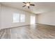 Living room with hardwood floors, sliding doors, and ceiling fan at 1247 Sunny Lake Dr, Lawrenceville, GA 30043