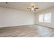 Bright living room featuring hardwood floors and ceiling fan at 1247 Sunny Lake Dr, Lawrenceville, GA 30043