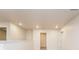 Loft area with carpeted floors, multiple doors, and neutral walls at 1247 Sunny Lake Dr, Lawrenceville, GA 30043
