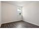 Bedroom with dark hardwood floors and a window at 1783 Juniper Berry Way, Loganville, GA 30052