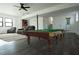 Finished basement with pool table, comfortable seating, and entertainment center at 2688 Heritage Ln, Morrow, GA 30260