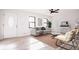 Living room with light hardwood floors, comfy seating, and lots of natural light at 2688 Heritage Ln, Morrow, GA 30260
