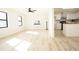 Open concept living and kitchen area with hardwood floors and lots of light at 2688 Heritage Ln, Morrow, GA 30260