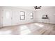 Bright and airy living room with hardwood floors and large windows at 2688 Heritage Ln, Morrow, GA 30260