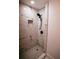 Large walk-in shower with marble tile and black fixtures at 2688 Heritage Ln, Morrow, GA 30260
