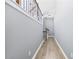 Bright hallway with hardwood floors and modern railing at 4194 Integrity Way, Powder Springs, GA 30127