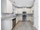 Modern kitchen featuring stainless steel appliances and granite countertops at 4194 Integrity Way, Powder Springs, GA 30127