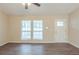 Living room with hardwood floors, neutral walls, and lots of natural light at 664 Tarragon Sw Way, Atlanta, GA 30331