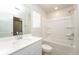 Bathroom includes a tub shower combo and single vanity at 1267 Sunny Lake Dr, Lawrenceville, GA 30043