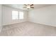 Bright bedroom with neutral carpet and ceiling fan at 1267 Sunny Lake Dr, Lawrenceville, GA 30043