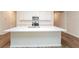 Large kitchen island with white quartz countertop and sink at 1267 Sunny Lake Dr, Lawrenceville, GA 30043