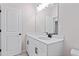 Bright bathroom featuring a white vanity and black accents at 1682 Juniper Berry Way, Loganville, GA 30052