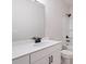 Modern bathroom with white vanity, black fixtures, and a shower at 1682 Juniper Berry Way, Loganville, GA 30052