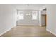 Dining room featuring beautiful wood-look flooring and modern chandelier at 1682 Juniper Berry Way, Loganville, GA 30052