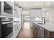 Modern kitchen with island and stainless steel appliances at 1682 Juniper Berry Way, Loganville, GA 30052