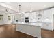 Modern kitchen with white cabinets, quartz countertops, and stainless steel appliances at 1682 Juniper Berry Way, Loganville, GA 30052