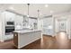 Open concept kitchen with white cabinets and a large island at 1682 Juniper Berry Way, Loganville, GA 30052