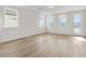 Bright living room with ample natural light and hardwood floors at 1682 Juniper Berry Way, Loganville, GA 30052