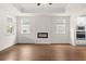 Living room with hardwood floors and an electric fireplace at 1682 Juniper Berry Way, Loganville, GA 30052